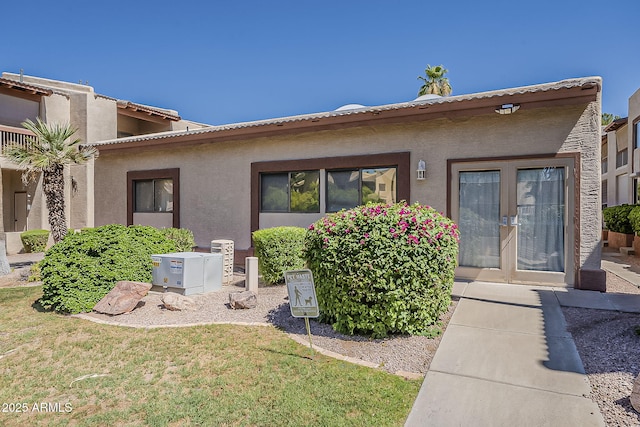 205 N 74th St Unit 261, Mesa, AZ 85207 - rear view of property featuring stucco siding and a tile roof