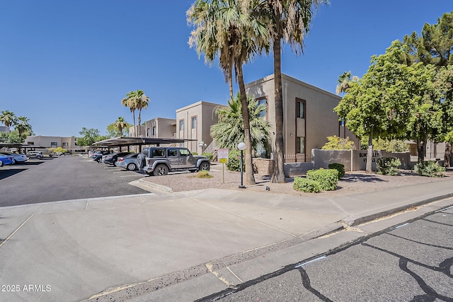 205 N 74th St Unit 261, Mesa, AZ 85207 - view of property with covered and uncovered parking and a residential view