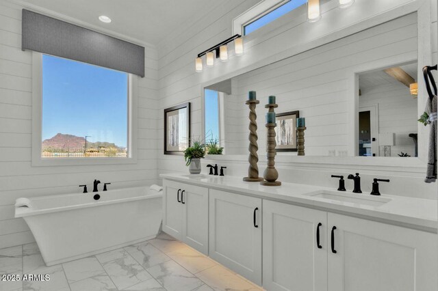 5756 E Star Valley St, Mesa, AZ 85215 - bathroom featuring double vanity, a sink, marble finish floor, and a soaking tub