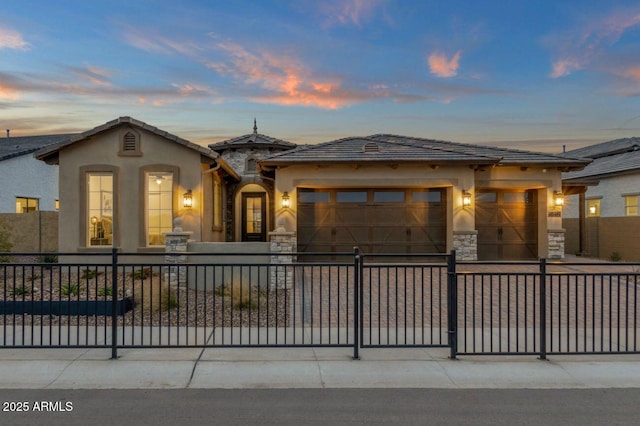 5756 E Star Valley St, Mesa, AZ 85215 - view of front of home with an attached garage, stucco siding, stone siding, and fence