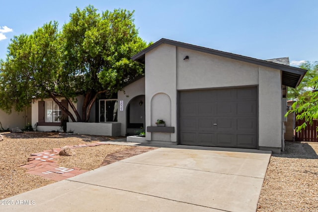 3039 W Ross Ave, Phoenix, AZ 85027 - view of front of house with an attached garage, driveway, and stucco siding