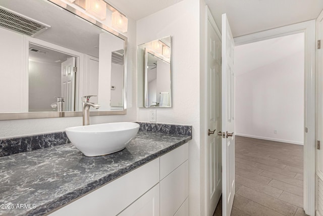 3039 W Ross Ave, Phoenix, AZ 85027 - bathroom featuring vanity and wood finished floors