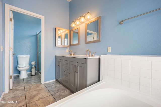 full bath with double vanity, toilet, a shower with shower door, baseboards, and a tub