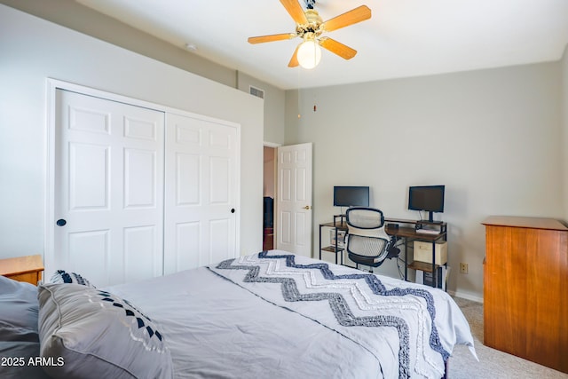 carpeted bedroom featuring a closet, ceiling fan, and baseboards