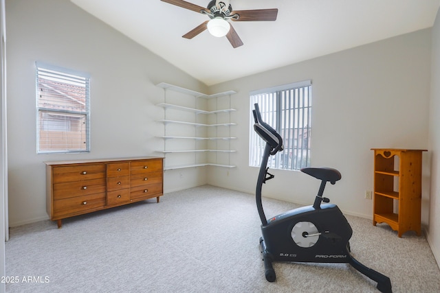 workout room featuring carpet floors, ceiling fan, plenty of natural light, vaulted ceiling, and baseboards