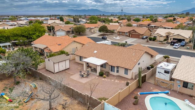 aerial view of residential area with a mountain backdrop