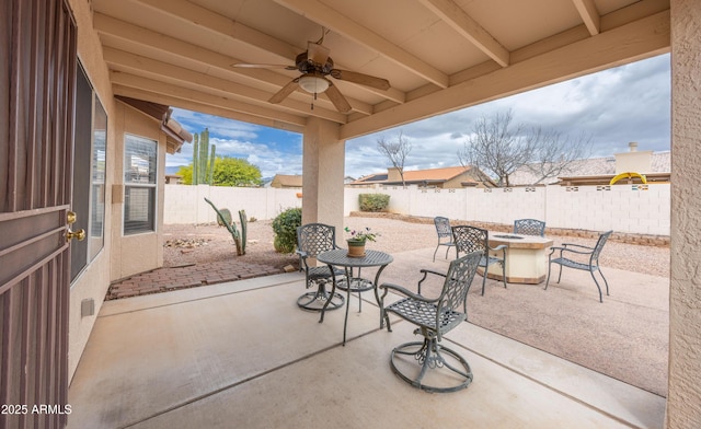 view of patio / terrace featuring a ceiling fan, a fenced backyard, and outdoor dining space