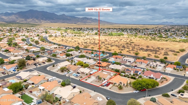 aerial view of residential area featuring mountains and property boundaries highlighted
