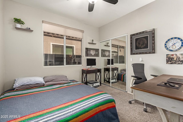 carpeted bedroom featuring ceiling fan and a closet