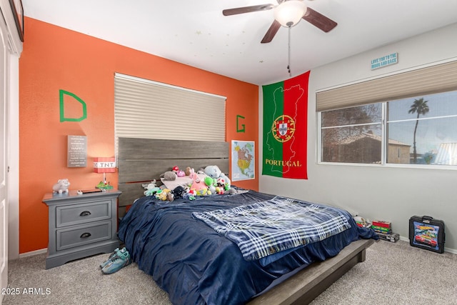 carpeted bedroom featuring a ceiling fan