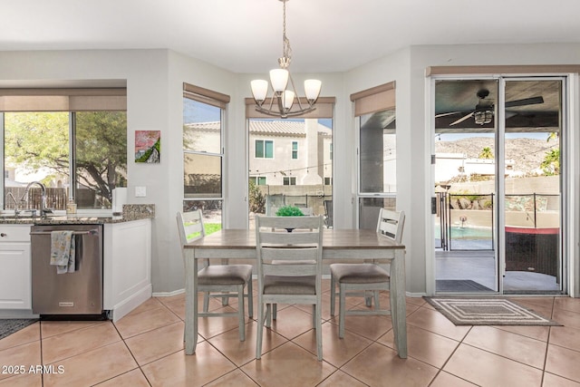 dining room with light tile patterned flooring and a notable chandelier