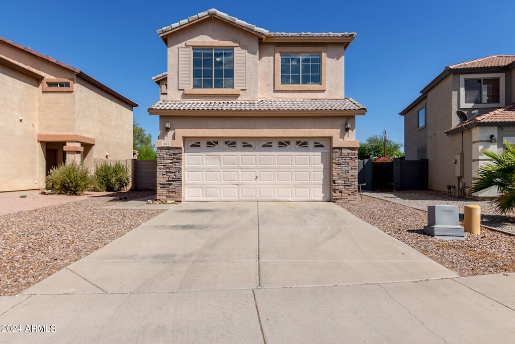 mediterranean / spanish-style home featuring a garage