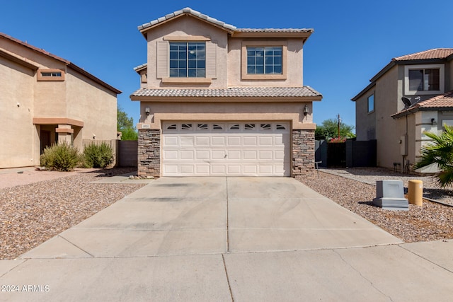 mediterranean / spanish-style home featuring a garage