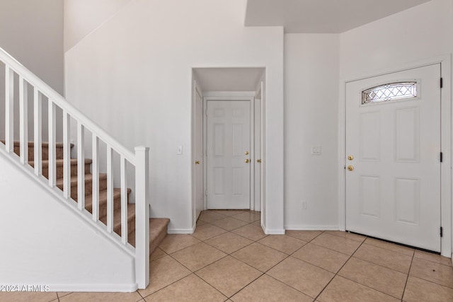 entrance foyer with light tile patterned floors