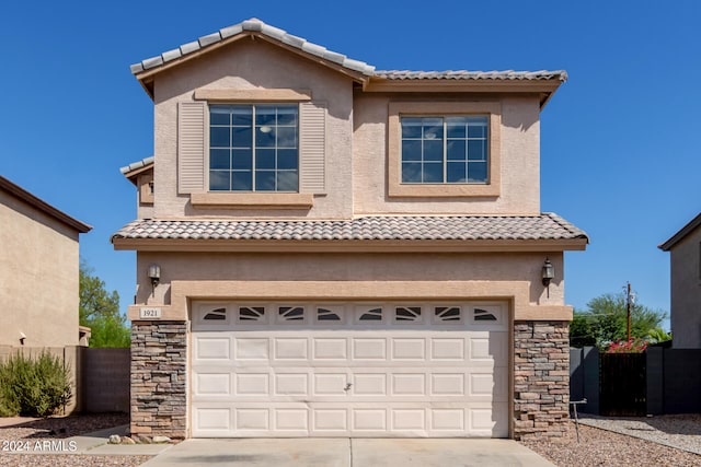 view of front of property with a garage