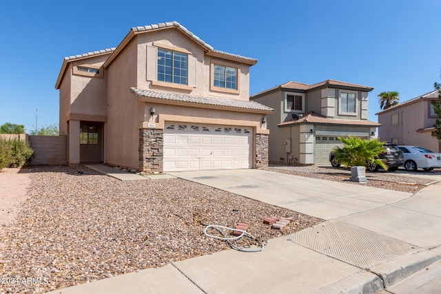 view of front of property with a garage