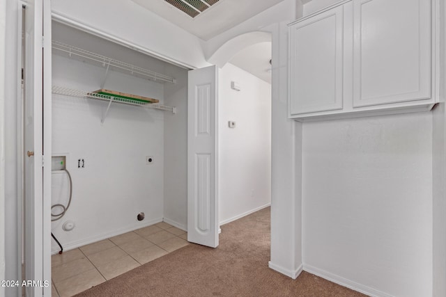 laundry area with hookup for a washing machine, light colored carpet, and electric dryer hookup