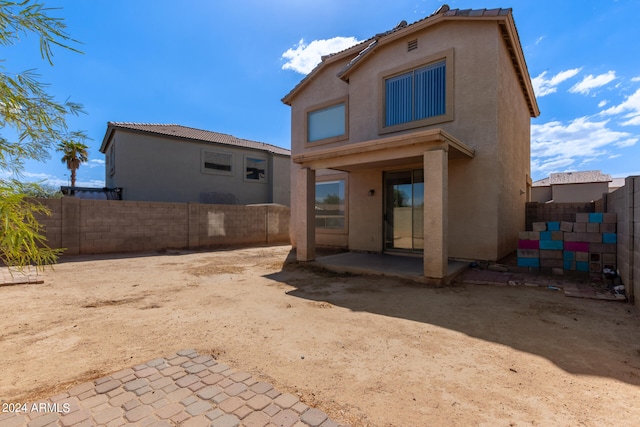 back of house featuring a patio