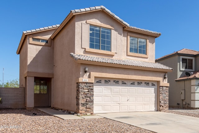 view of front of property featuring a garage