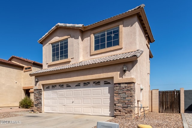 view of front of property with a garage