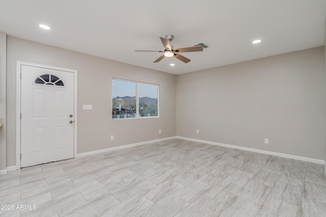 interior space with ceiling fan