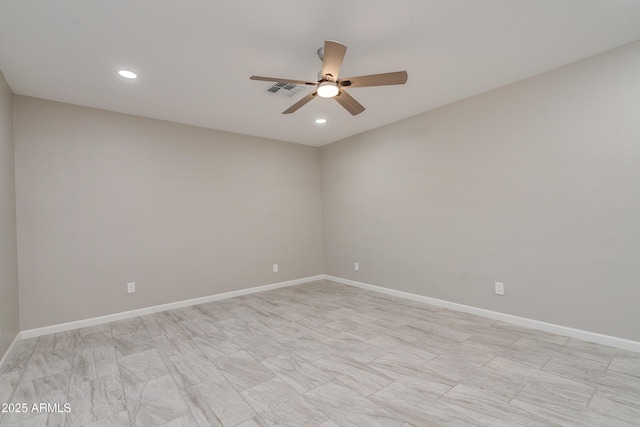 spare room featuring ceiling fan