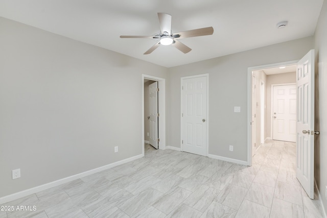 unfurnished bedroom featuring ceiling fan