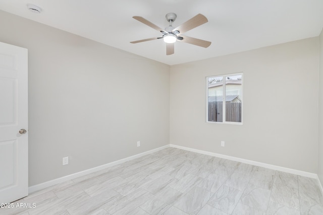 spare room with ceiling fan