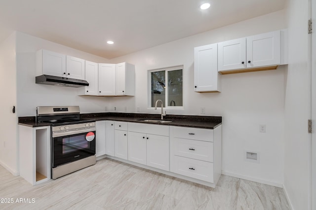 kitchen with sink, white cabinets, and electric stove