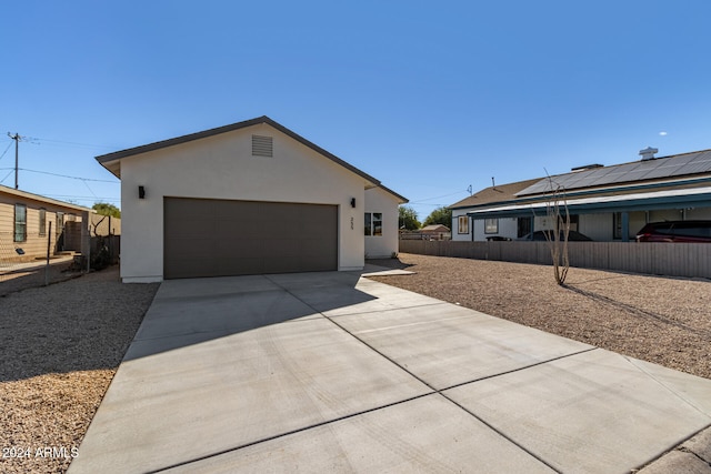 view of property exterior featuring a garage