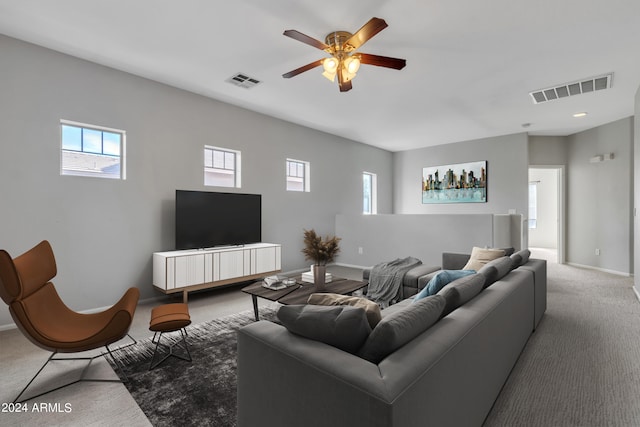 living room featuring carpet floors and ceiling fan