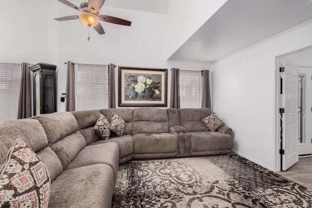 living room featuring ceiling fan and hardwood / wood-style floors