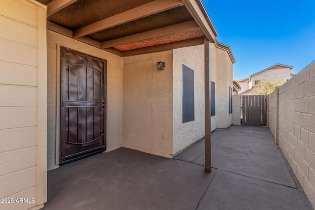 doorway to property featuring a patio area