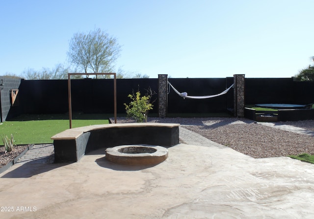 view of patio / terrace featuring an outdoor fire pit