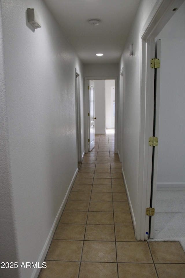 hallway featuring light tile patterned flooring