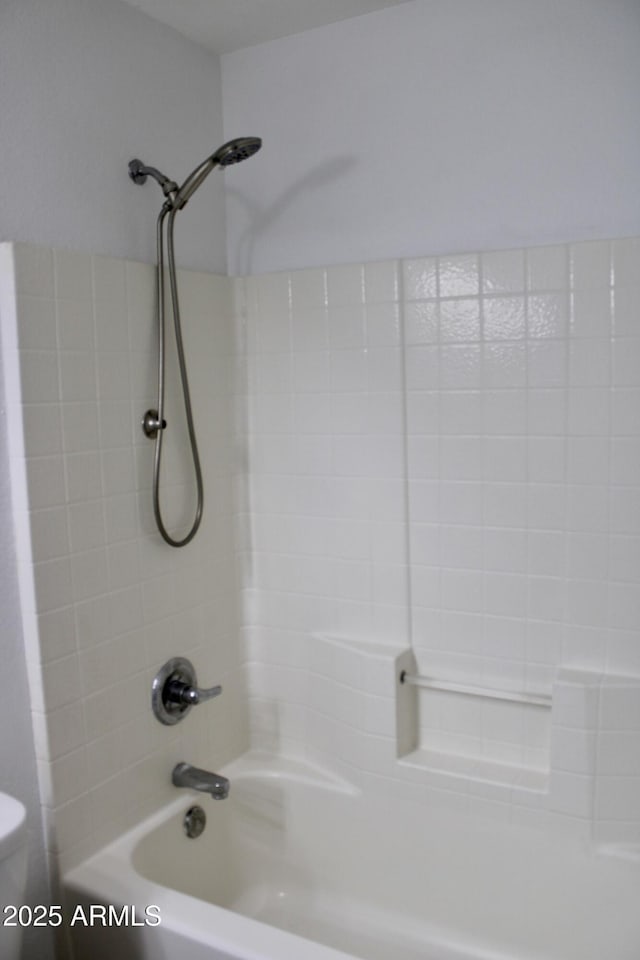 bathroom with toilet and shower / tub combination