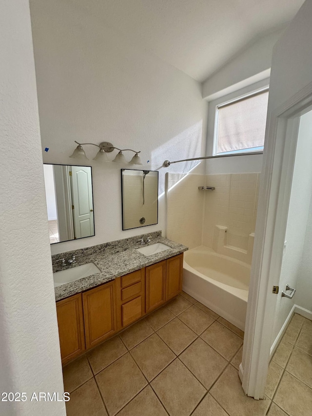 bathroom featuring vanity, bathtub / shower combination, and tile patterned floors