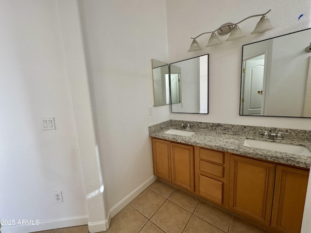 bathroom featuring tile patterned flooring and vanity