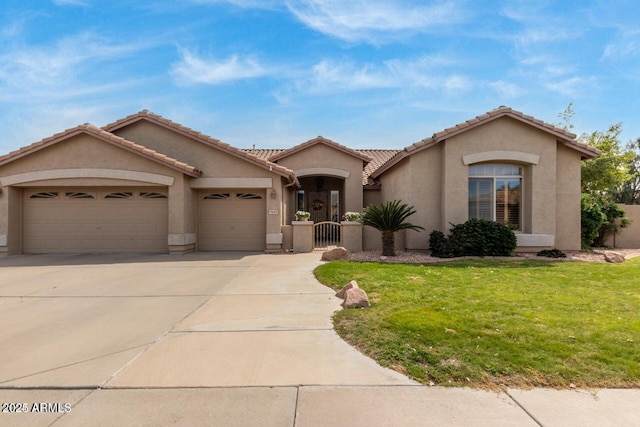 view of front of home featuring a garage and a front lawn