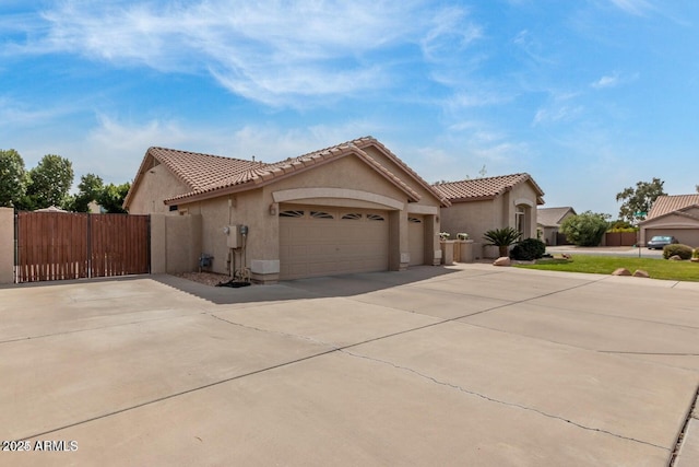 mediterranean / spanish-style home with a garage