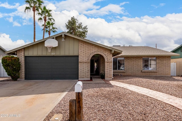 ranch-style home with an attached garage, driveway, board and batten siding, and brick siding