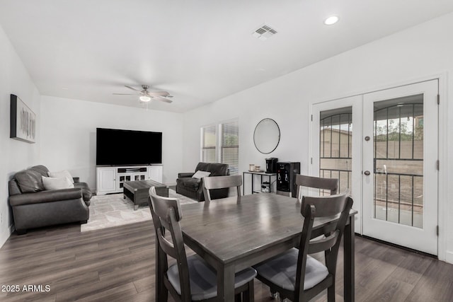 dining area with a wealth of natural light, visible vents, french doors, and a ceiling fan