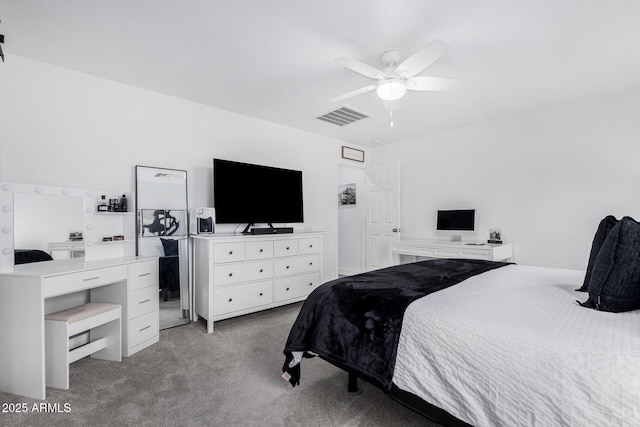 bedroom featuring visible vents, a ceiling fan, and carpet