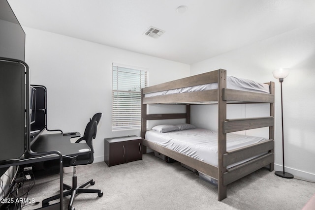 bedroom with carpet, visible vents, and baseboards