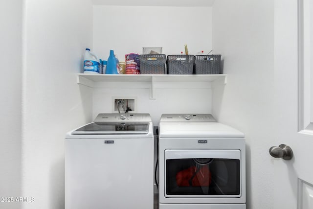 laundry area with separate washer and dryer and laundry area