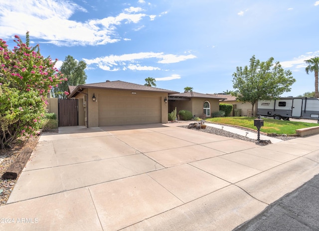 5119 W Onyx Ave, Glendale, AZ 85302 - ranch-style home featuring stucco siding, an attached garage, concrete driveway, and a front lawn
