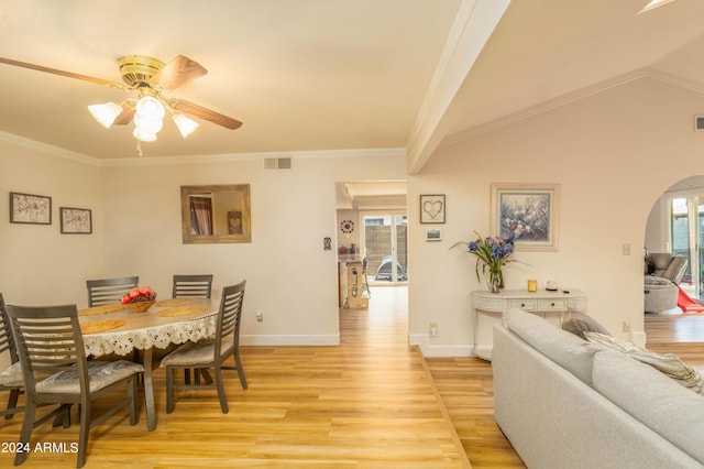 5119 W Onyx Ave, Glendale, AZ 85302 - dining space featuring baseboards, ornamental molding, light wood-style flooring, arched walkways, and a ceiling fan