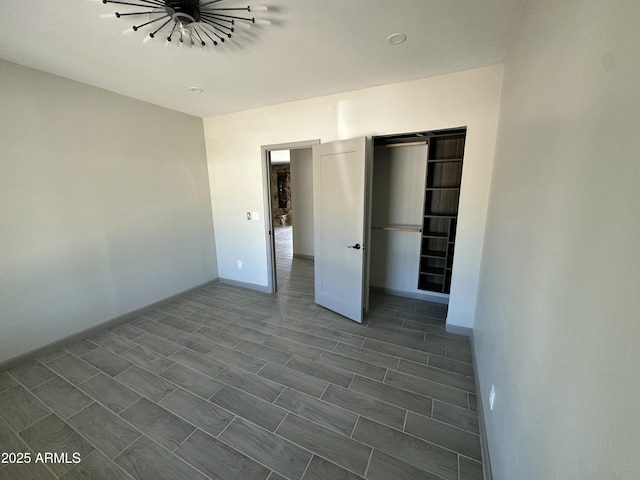 unfurnished bedroom with baseboards