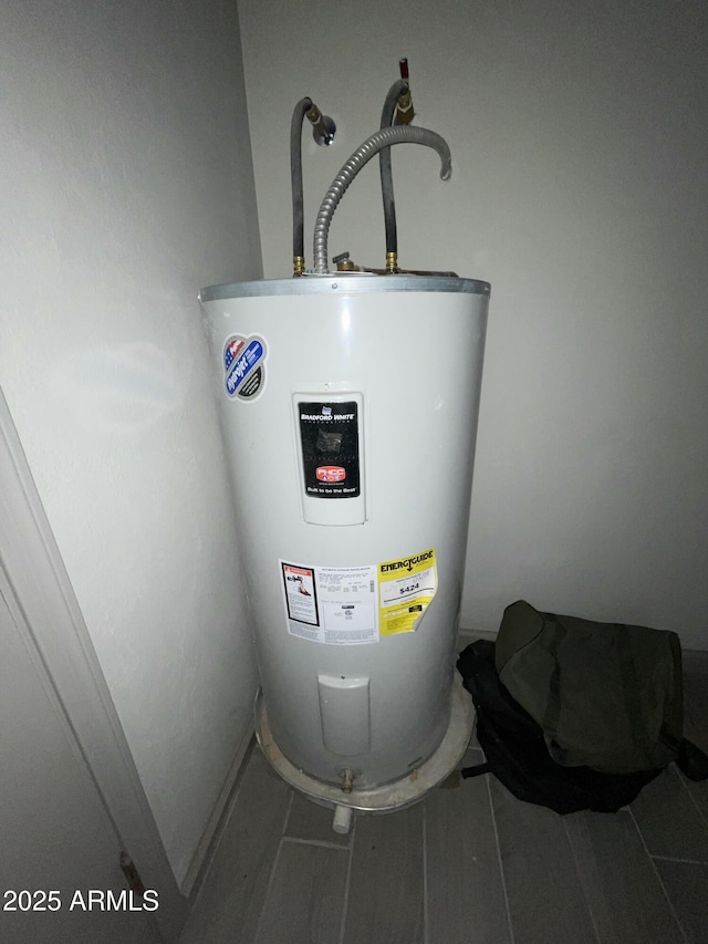utility room with water heater