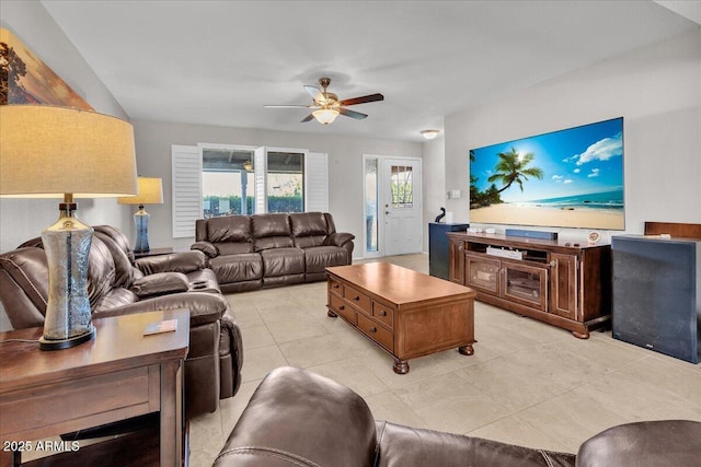 living area with light tile patterned floors and ceiling fan